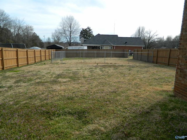 view of yard featuring a fenced backyard