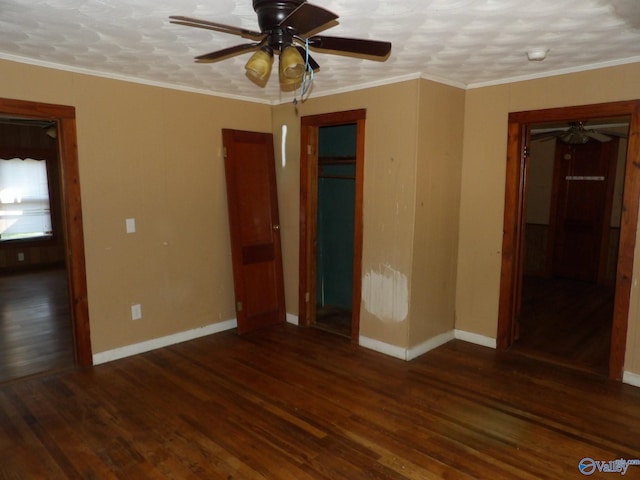 unfurnished bedroom with crown molding, dark hardwood / wood-style floors, a closet, and ceiling fan