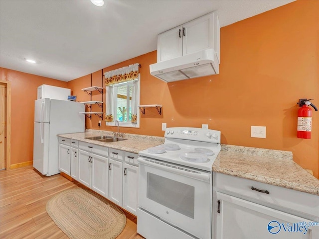 1228 Matt Morrow Rd, Arab, AL 35016 - kitchen with white appliances, under cabinet range hood, white cabinetry, light wood-style flooring, and open shelves