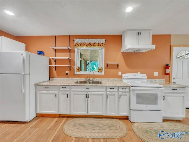 1228 Matt Morrow Rd, Arab, AL 35016 - kitchen with white appliances, white cabinetry, light wood-style floors, under cabinet range hood, and recessed lighting