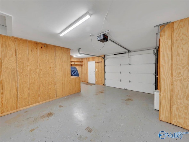 1228 Matt Morrow Rd, Arab, AL 35016 - garage with a garage door opener and wood walls