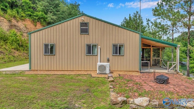 1228 Matt Morrow Rd, Arab, AL 35016 - view of side of home featuring an outdoor fire pit, a yard, and a patio area