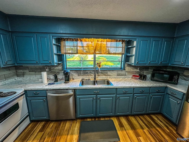 kitchen featuring black microwave, a sink, dishwasher, open shelves, and dark wood finished floors