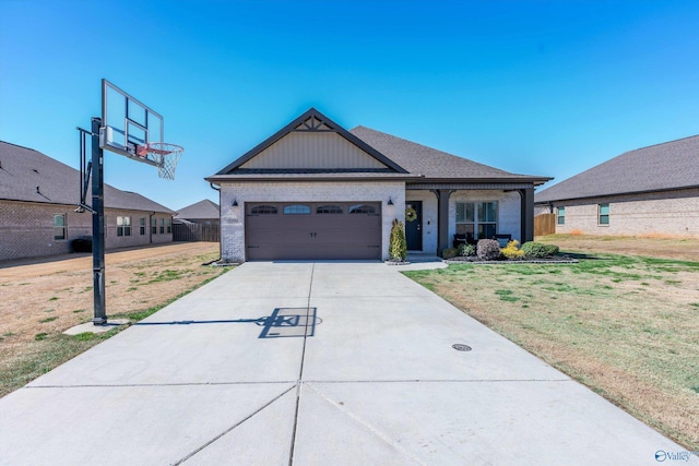 view of front of house featuring concrete driveway, a garage, fence, and a front lawn