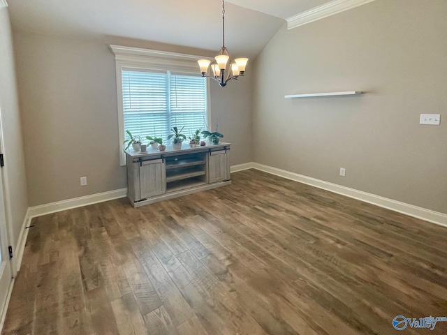 14537 Willow Bend Dr, Athens, AL 35613 - dining room with dark wood-type flooring, a chandelier, lofted ceiling, baseboards, and ornamental molding