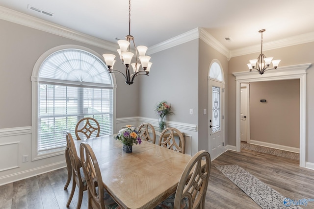14537 Willow Bend Dr, Athens, AL 35613 - dining room featuring a chandelier, wood finished floors, ornamental molding, and wainscoting