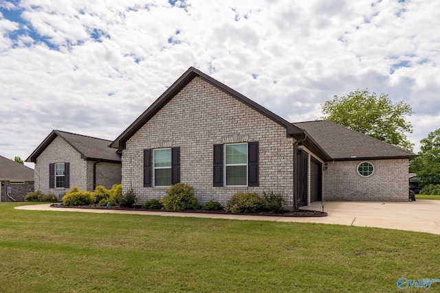 14537 Willow Bend Dr, Athens, AL 35613 - view of front of property with concrete driveway, a garage, brick siding, and a front yard