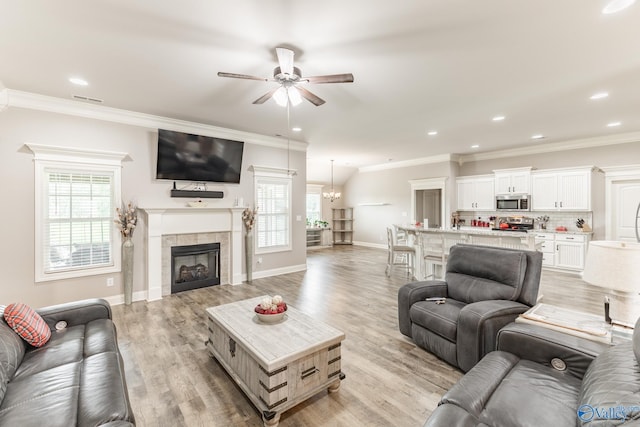 14537 Willow Bend Dr, Athens, AL 35613 - living area featuring ceiling fan, plenty of natural light, ornamental molding, light wood-style flooring, and recessed lighting