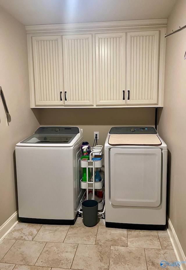 14537 Willow Bend Dr, Athens, AL 35613 - washroom featuring separate washer and dryer, cabinet space, and baseboards
