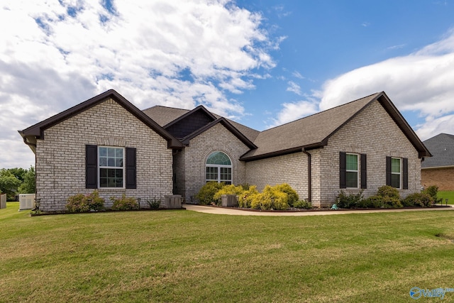14537 Willow Bend Dr, Athens, AL 35613 - view of front of home with brick siding, a front yard, and a shingled roof