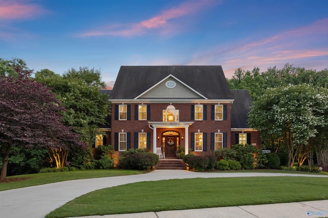 24608 Savannah Trl, Athens, AL 35613 - colonial house with a yard and brick siding