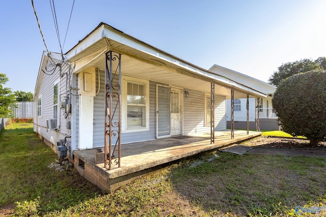 3509 7th Ave, Huntsville, AL 35805 - rear view of property with covered porch and a lawn