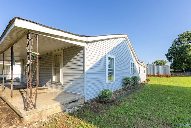 3509 7th Ave, Huntsville, AL 35805 - view of property exterior with a lawn and a patio area