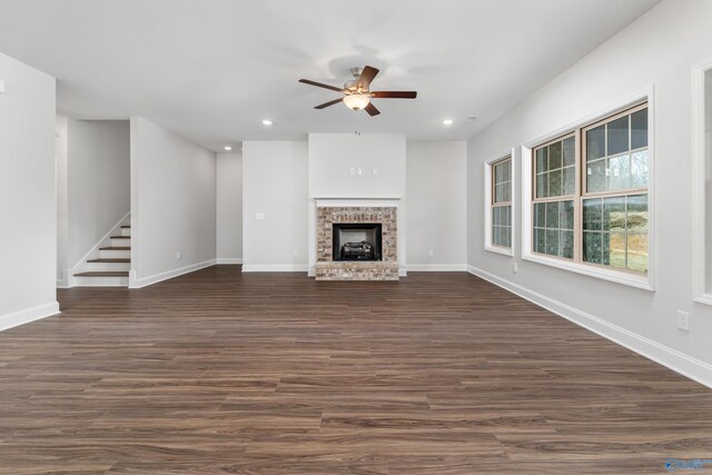 kitchen featuring stainless steel refrigerator, premium range hood, crown molding, pendant lighting, and hardwood / wood-style flooring