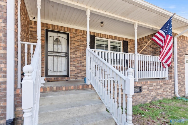 entrance to property featuring covered porch