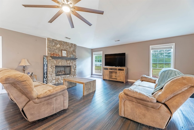 4198 Pilgrims Rest Rd, Southside, AL 35907 - living room featuring healthy amount of natural light, a ceiling fan, dark wood-style flooring, lofted ceiling, and a stone fireplace