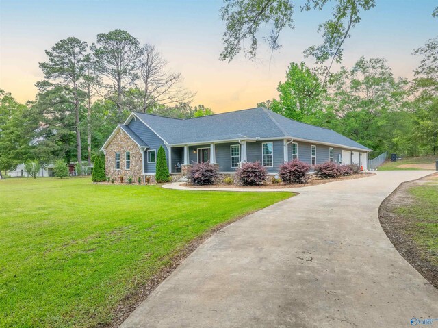 4198 Pilgrims Rest Rd, Southside, AL 35907 - ranch-style home featuring a front yard, stone siding, and concrete driveway