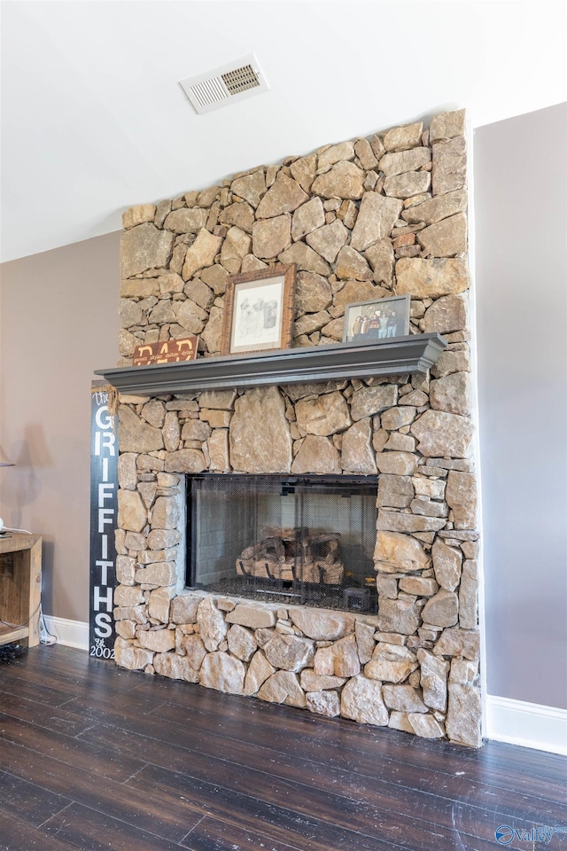 4198 Pilgrims Rest Rd, Southside, AL 35907 - detailed view of baseboards, wood finished floors, and a stone fireplace