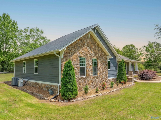 4198 Pilgrims Rest Rd, Southside, AL 35907 - view of side of home with stone siding, central AC, and a porch