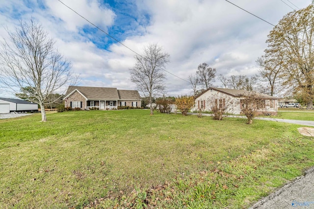 ranch-style house with a front yard