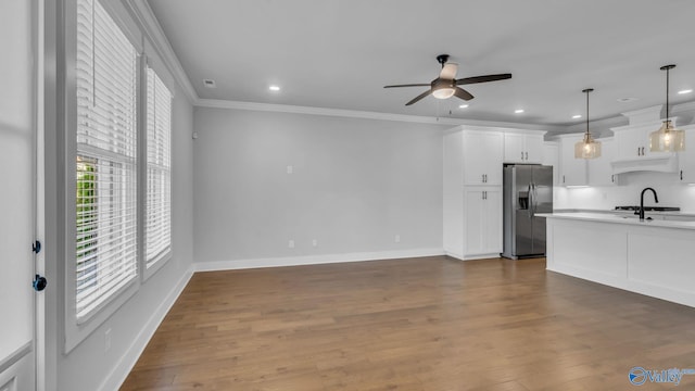 130 Iberville St, Madison, AL 35758 - kitchen with stainless steel fridge, ceiling fan, ornamental molding, white cabinets, and light countertops
