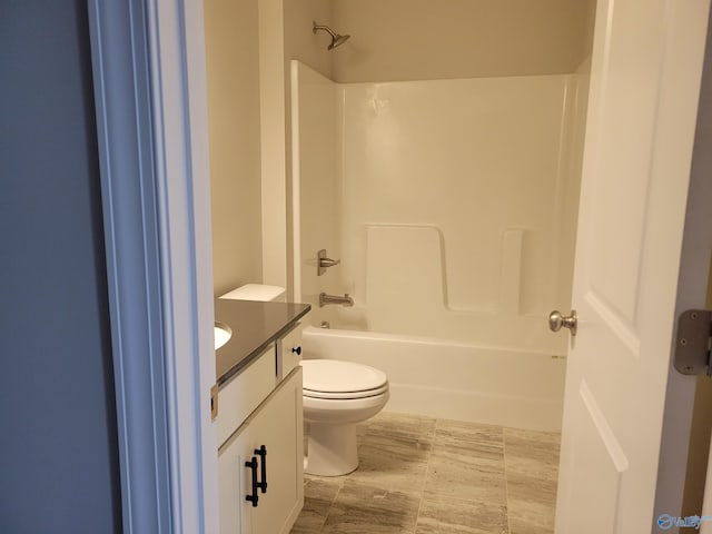 full bathroom featuring tile patterned flooring, shower / bath combination, toilet, and vanity