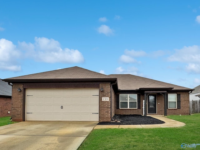 view of front of house with a garage and a front lawn