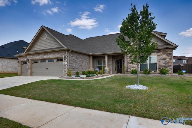 craftsman house with a garage and a front lawn