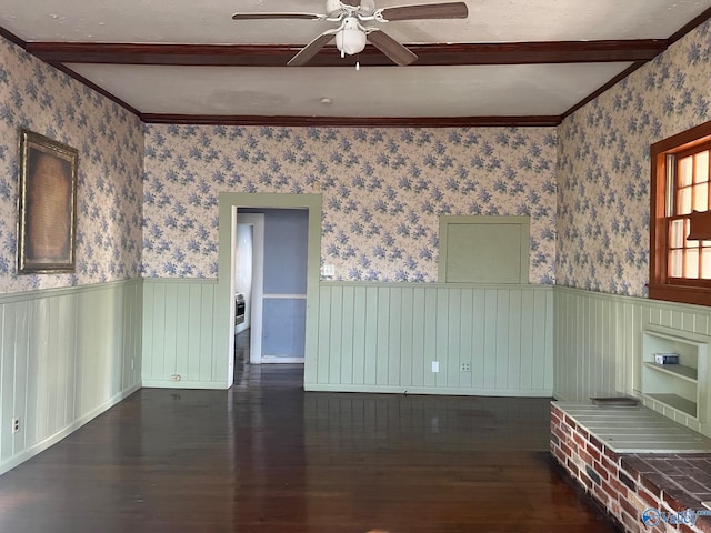 unfurnished room featuring crown molding, dark hardwood / wood-style flooring, and ceiling fan