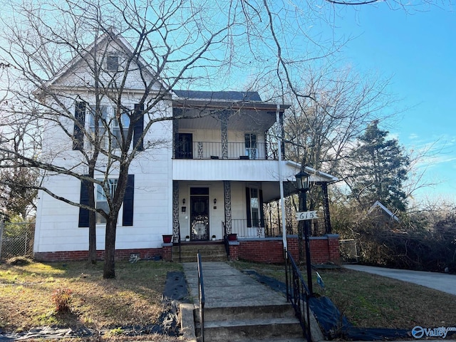 view of front of house with a balcony and a porch