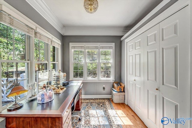 home office with light hardwood / wood-style floors