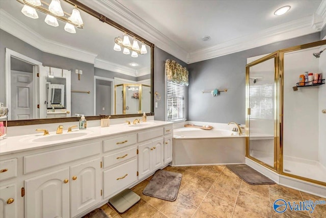 bathroom featuring crown molding, vanity, and independent shower and bath