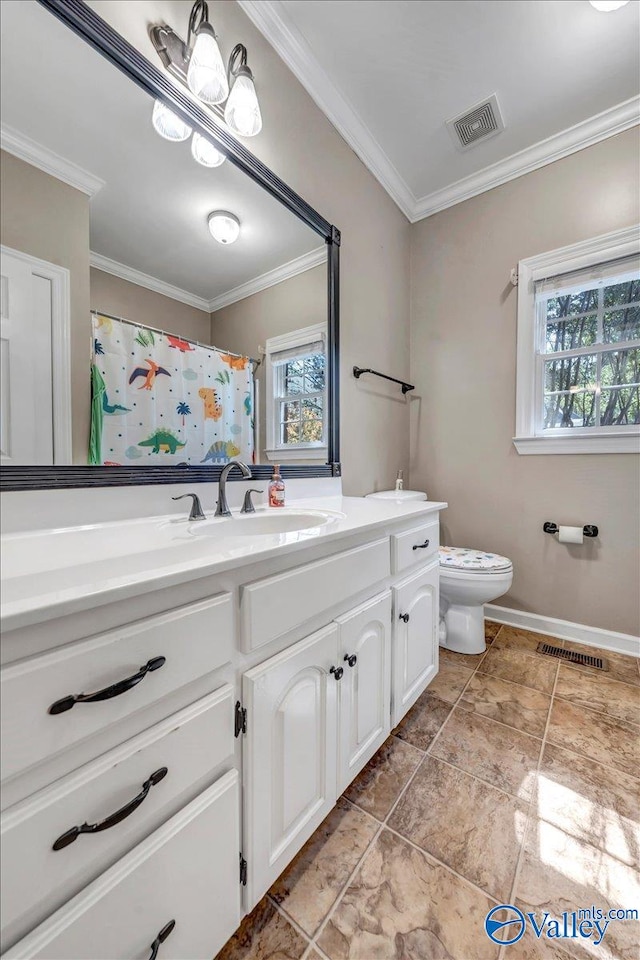 bathroom featuring vanity, crown molding, and toilet