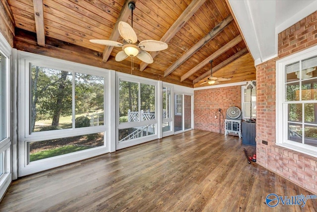 unfurnished sunroom featuring lofted ceiling with beams, ceiling fan, and wooden ceiling