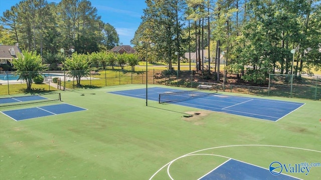 view of sport court with basketball hoop