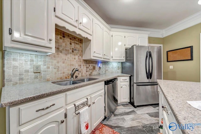 kitchen with stainless steel appliances, backsplash, white cabinets, and sink