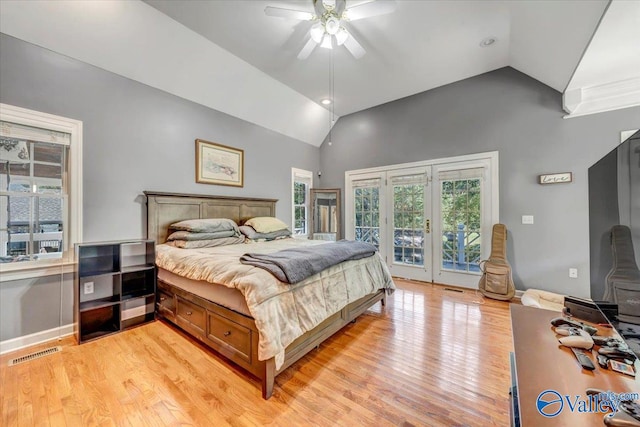 bedroom with access to exterior, high vaulted ceiling, ceiling fan, and light hardwood / wood-style floors