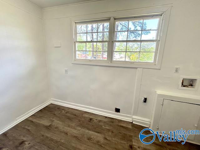 laundry area featuring hookup for a washing machine, dark wood-style flooring, laundry area, and baseboards