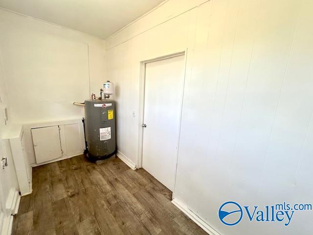 utility room featuring water heater
