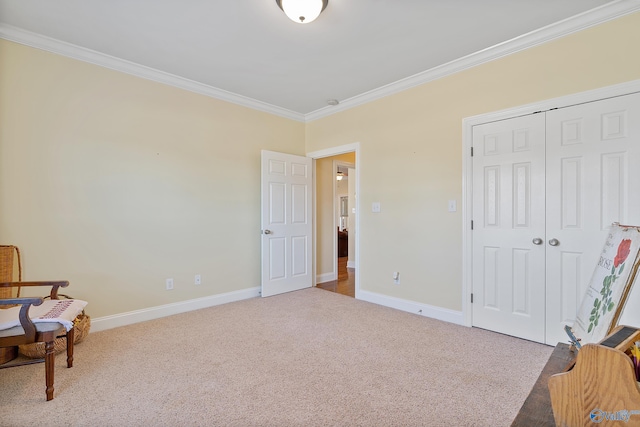 sitting room featuring baseboards, carpet, and crown molding