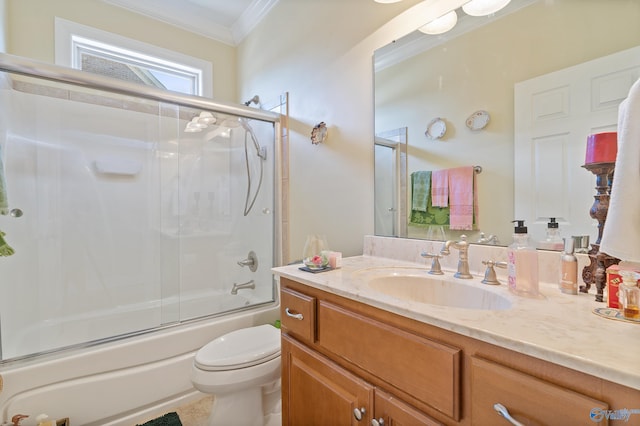 full bathroom with shower / bath combination with glass door, toilet, vanity, and ornamental molding