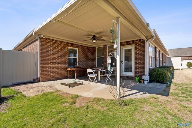 view of patio featuring fence and ceiling fan