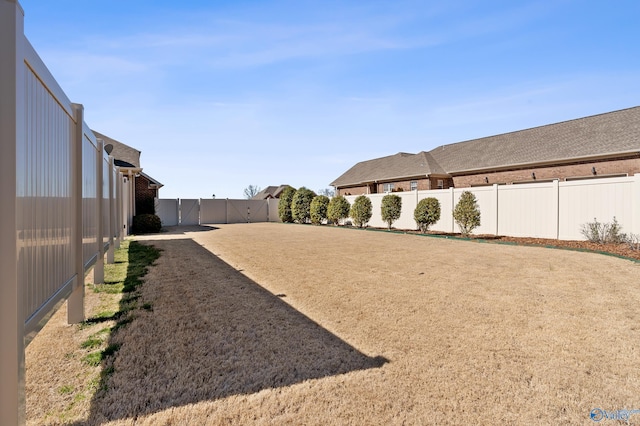 view of yard featuring a fenced backyard