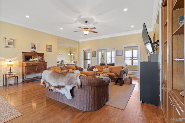 living room featuring recessed lighting, ornamental molding, a ceiling fan, and light wood finished floors