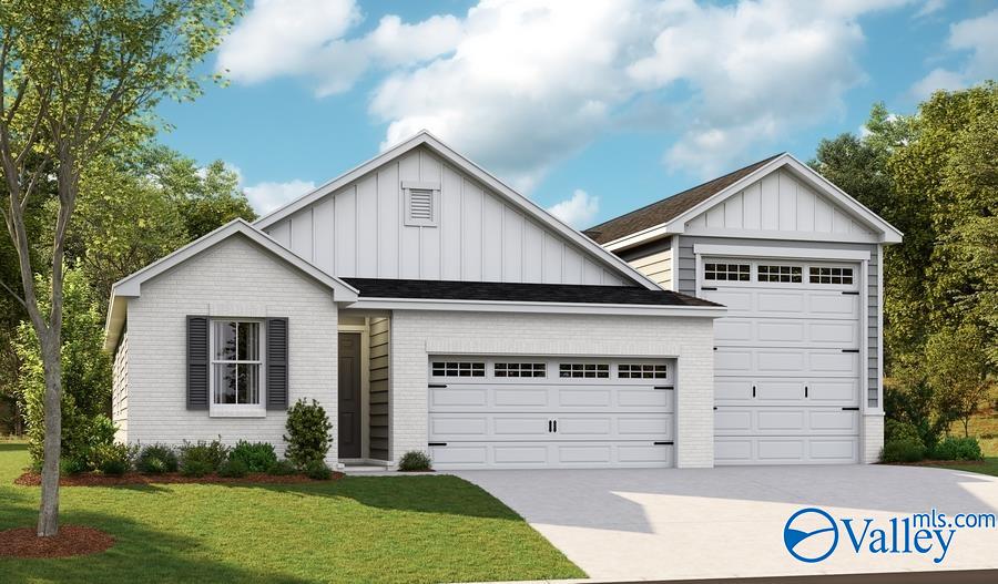 modern farmhouse with an attached garage, brick siding, board and batten siding, and driveway