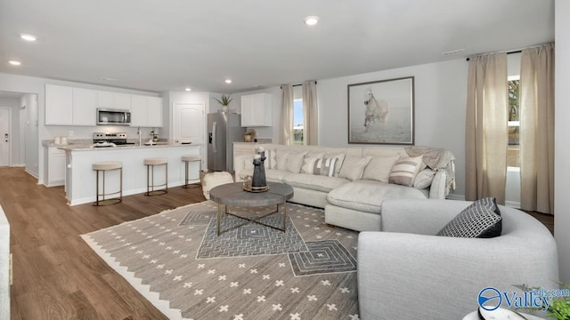 18876 Wicklow Cir, Athens, AL 35613 - living room featuring sink and light wood-type flooring