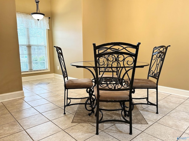 dining space featuring light tile patterned floors