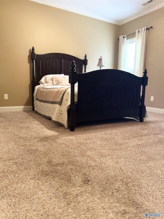 carpeted bedroom featuring crown molding