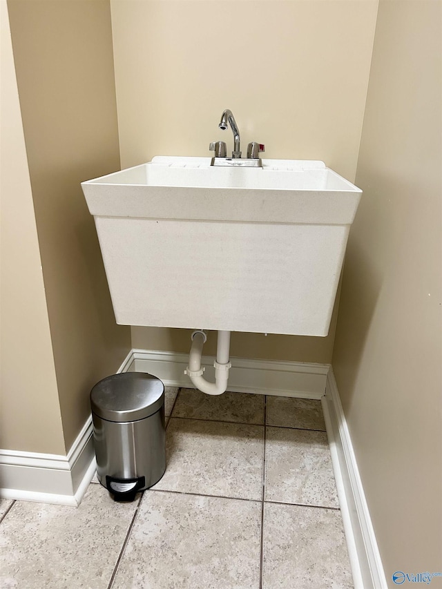 bathroom featuring tile patterned flooring and sink