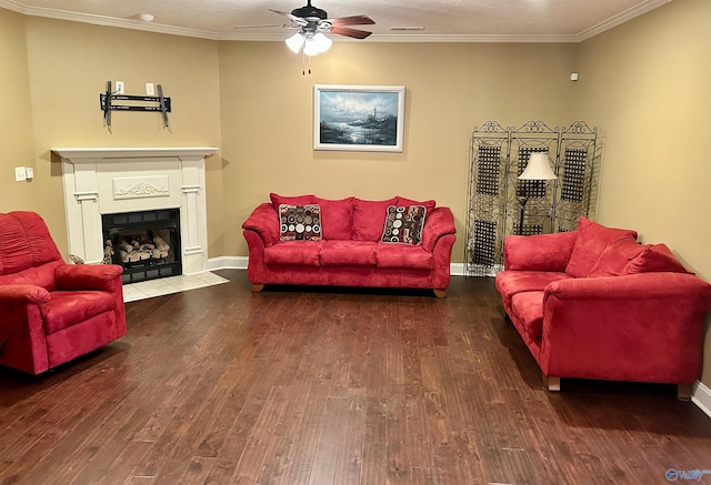 living room featuring wood-type flooring, ornamental molding, and ceiling fan